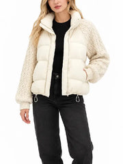 Front view of women's cream cropped puffer jacket with funnel collar, zipper and knit sleeves