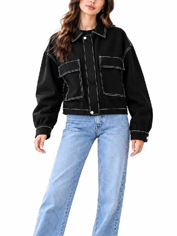 Front view of women’s black cropped jacket with chest flap pockets, shirt collar, and snap button closure