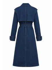 Back view of women's oversized blue denim trench coat with belted waist and dropped shoulders