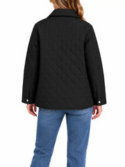 Woman wearing black diamond quilted shirt jacket, back view
