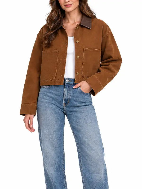 Front view of brown cropped workwear jacket showing button closure and patch pockets