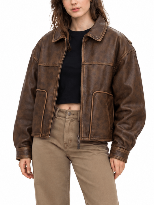 Front close-up of women’s oversized vintage leather jacket with shirt collar and contrast stitching