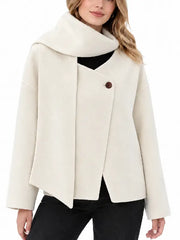 Woman wearing a cream wool blend short coat with attached scarf collar and single button front