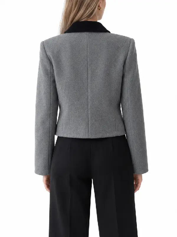 Back view of women's grey wool blend cropped jacket with black velvet collar and structured shoulders