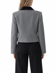Back view of women's grey wool blend cropped jacket with black velvet collar and structured shoulders