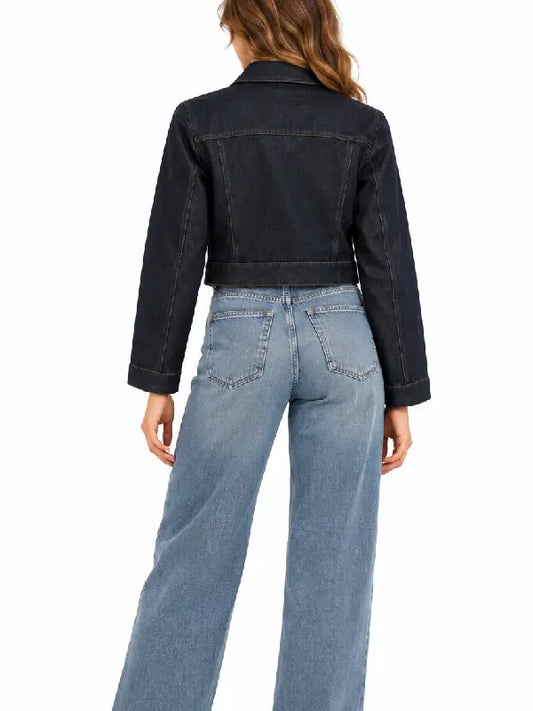 Back view of a woman wearing a dark indigo cropped denim jacket with wide leg jeans