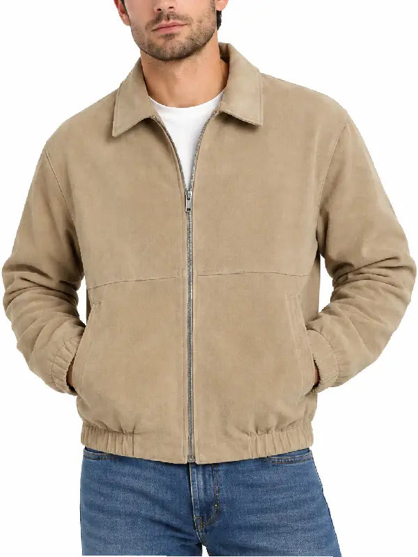 Man wearing khaki suede zip-up jacket with jeans, front close-up view