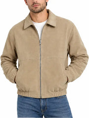 Man wearing khaki suede zip-up jacket with jeans, front close-up view